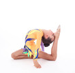 Photo: Beautiful flexible girl gymnast over white background Beautiful flexible girl gymnast over white background
