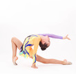 Photo: Beautiful flexible girl gymnast over white background Beautiful flexible girl gymnast over white background