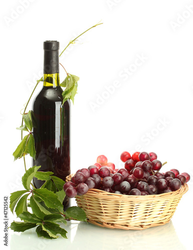 Photo: bottle of wine with grapes isolated on white bottle of wine with grapes isolated on white