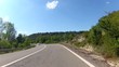 Vehicle point-of-view driving along mountains