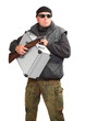 Dangerous gangster with gun and stolen money in suitcase.