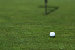 golf ball on lip of cup