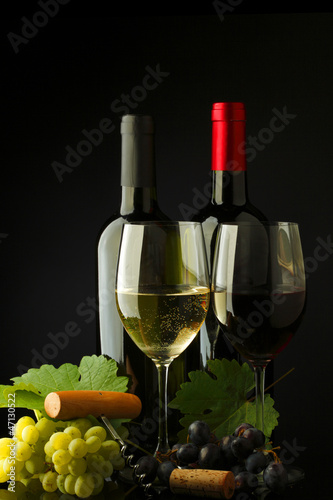 Photo: two bottle of red and white wine two bottle of red and white wine