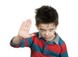 Little boy showing stop with his hand