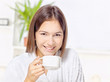 Foto: Woman in bathrobe relaxing at home Woman in bathrobe relaxing at home