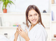 Woman in bathrobe relaxing at home