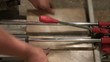 Man Cutting Tile Manually