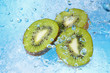 water splashing on kiwi slices-top view