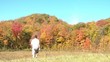 Man Hiking in Fall Season - Waving In