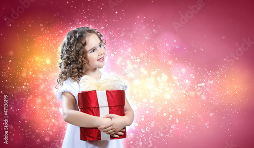 Photo: Happy girl opening gift box Happy girl opening gift box