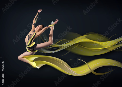 Photo: Young woman in gymnast suit posing Young woman in gymnast suit posing