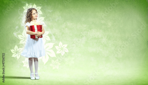 Photo: Happy girl opening gift box Happy girl opening gift box