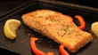 Juicy salmon fillet cooking on hot barbecue. Locked down.