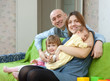 Happy family of four with newborn baby