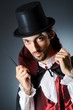 Magician doing tricks in dark room