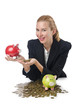 Woman breaking piggy bank for savings