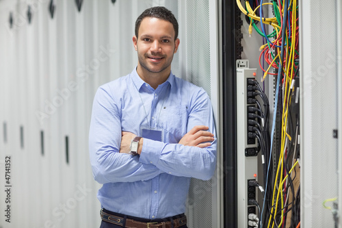 Photo: Technician standing next to the data store Technician standing next to the data store