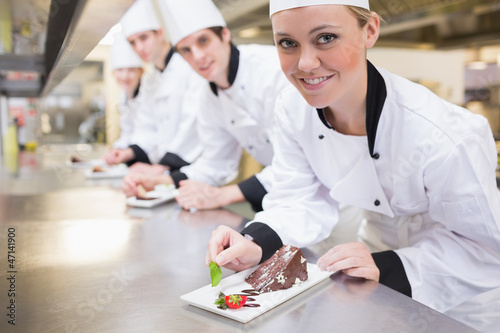 Photo: Smiling Chef's finishing dessert plates Smiling Chef's finishing dessert plates