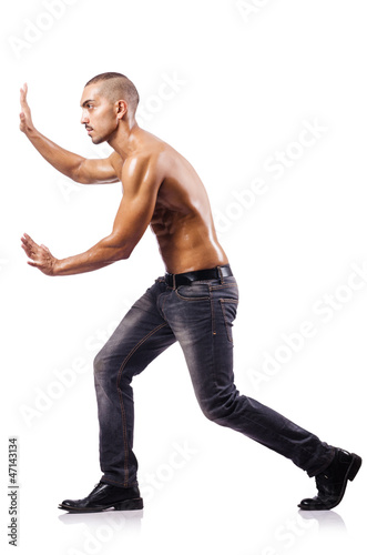 Photo: Nude man isolated on the white background Nude man isolated on the white background