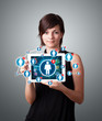 young woman holding tablet with social network icons