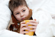 Sick boy lying in bed