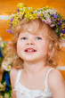 Foto: Beautiful little girl wearing a wreath Beautiful little girl wearing a wreath