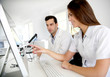 Photo: Students working on desktop computer in laboratory Students working on desktop computer in laboratory