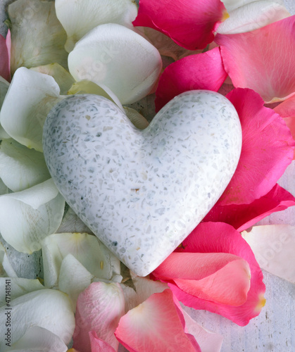 Photo: White marple heart with rose petals White marple heart with rose petals