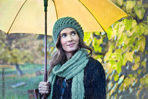 Photo: Woman with yellow umbrella smiling Woman with yellow umbrella smiling