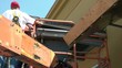 Two Men Working on Lift