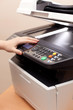 Woman's hand with copier