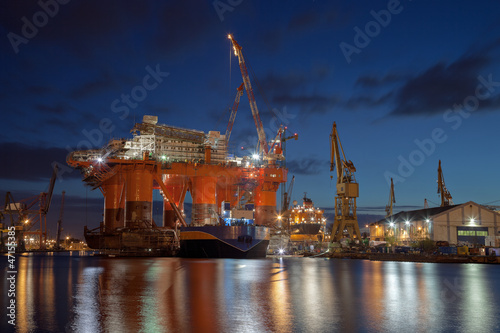 Photo: Repair of the oil rig in the shipyard. Repair of the oil rig in the shipyard.