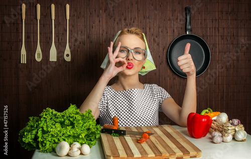 Photo: Woman cook with thumb up, yes Woman cook with thumb up, yes