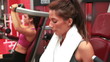 Woman wiping sweat away