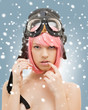 pink hair girl in aviator helmet with snow