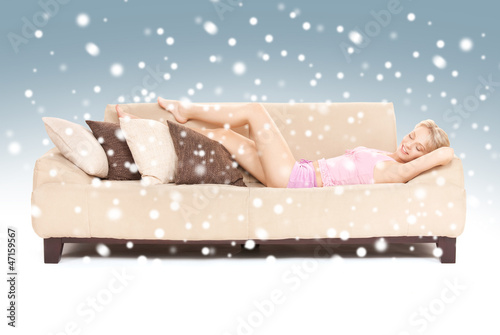 Photo: sleeping woman on sofa with snow sleeping woman on sofa with snow