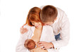 . Parents admiring the newborn  Family concept.
