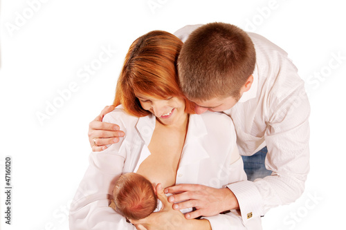 Photo: . Parents admiring the newborn Family concept. . Parents admiring the newborn Family concept.