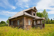 Foto: Old wooden house in russian village. Novgorod region, Russia. Old wooden house in russian village. Novgorod region, Russia.