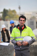 Foreman surveying construction