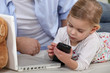 Child playing with  mobile phone