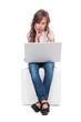 girl is boring and looking at the laptop