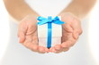 Photo: Gift box in female hands Gift box in female hands