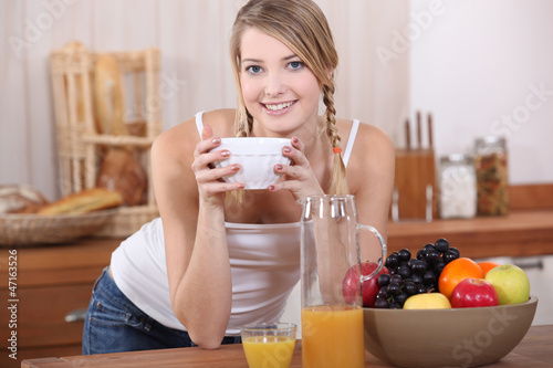 Photo: Woman having breakfast. Woman having breakfast.