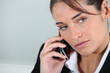 Businesswoman holding mobile telephone