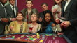 Women winning at roulette and cash falling on them