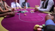 Man looking at his amazing poker hand and betting his house