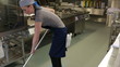Video: Cleaner of a kitchen wiping the floor Cleaner of a kitchen wiping the floor
