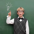 Schoolboy at the Blackboard with Idea