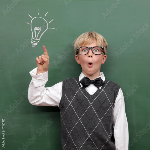 Photo: Schoolboy at the Blackboard with Idea Schoolboy at the Blackboard with Idea